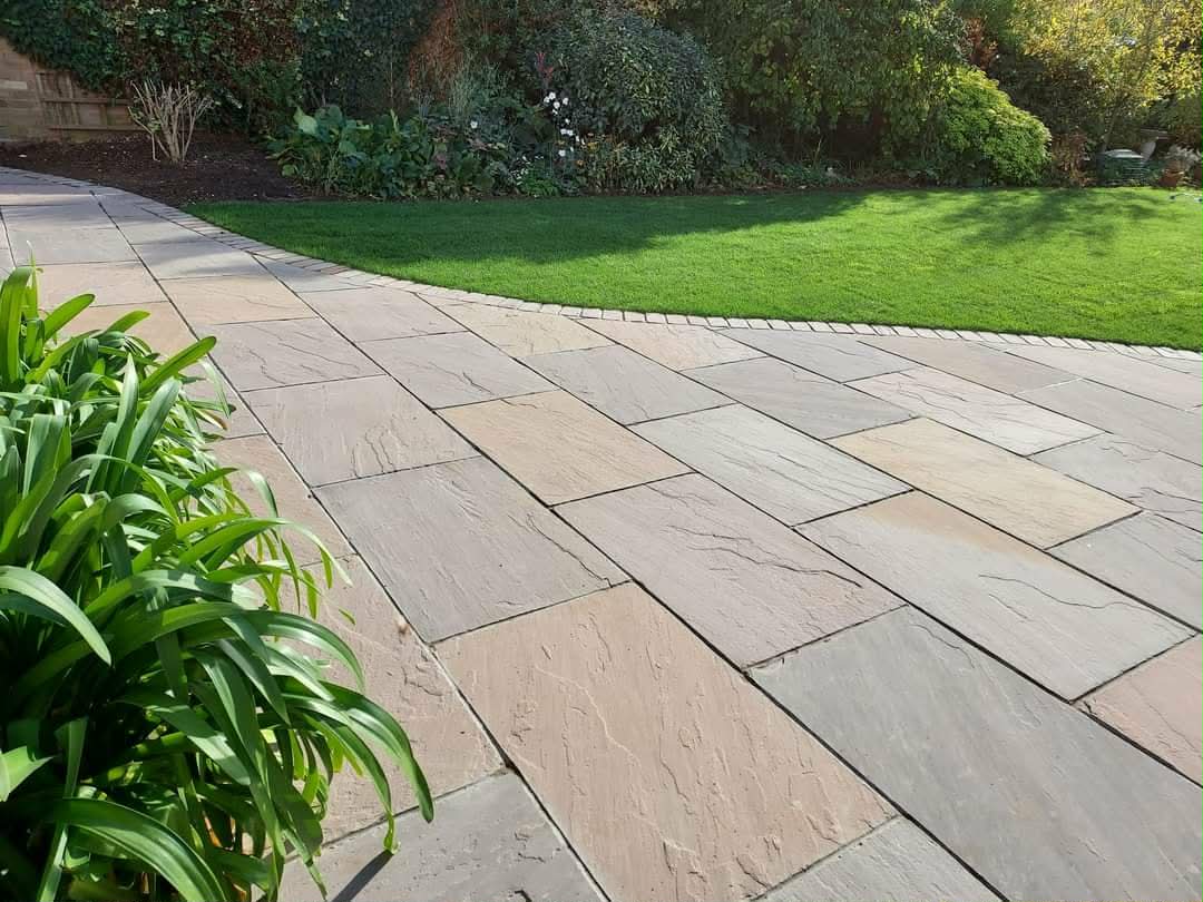 Curved natural stone patio installation near Boston, Lincolnshire